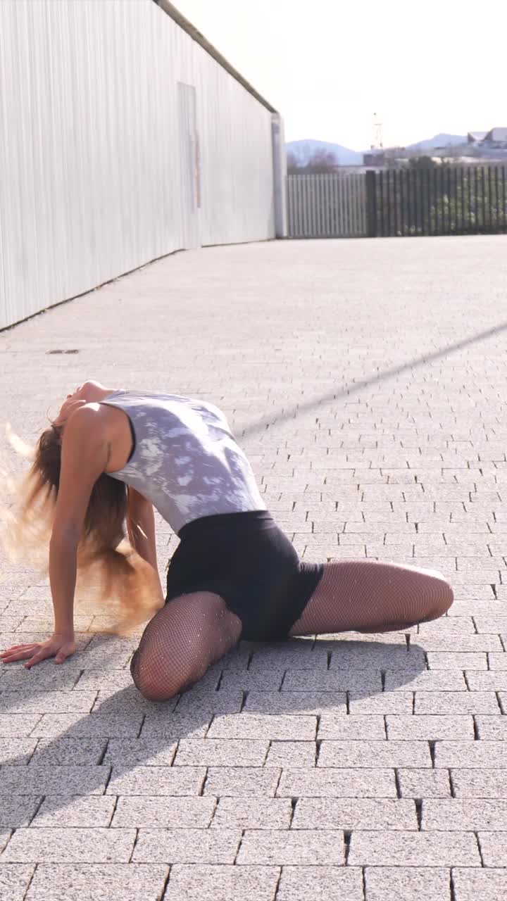 Woman dancing in an urban environment