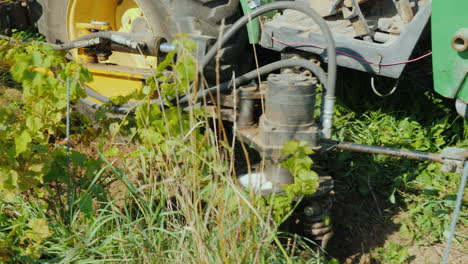 an agricultural machine uproots the weeds growing pesticide-free products organic farming