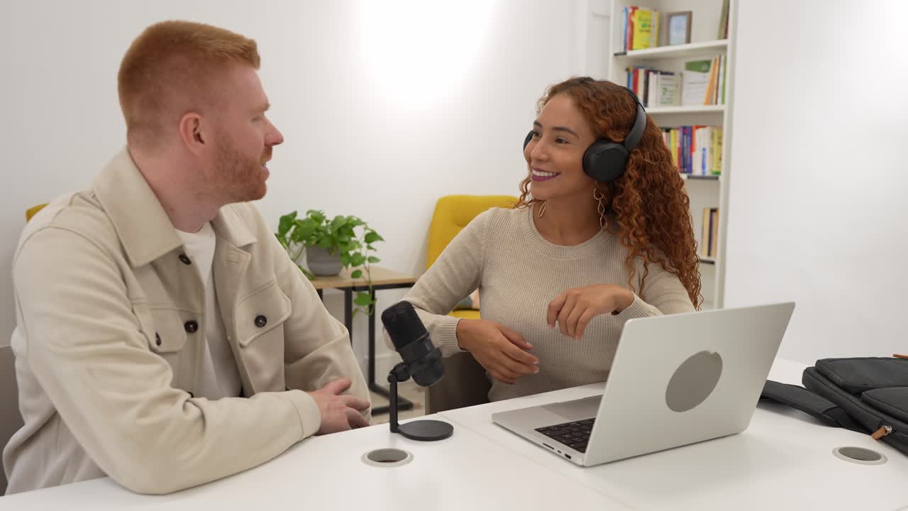 Man and Woman Recording a Podcast Interview in a Modern Studio