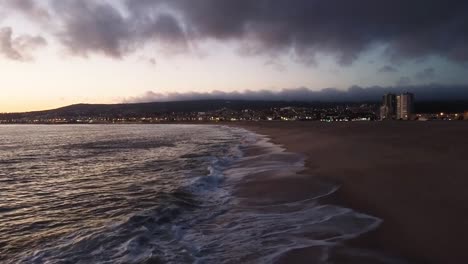 drone flying at the beach at sunset