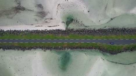 Lofoten-Midnattsolveien-Norway-road-with-sandy-sea-aerial-shot-|-DJI-Air-2-S-|-Car-|-Road-|-Opening