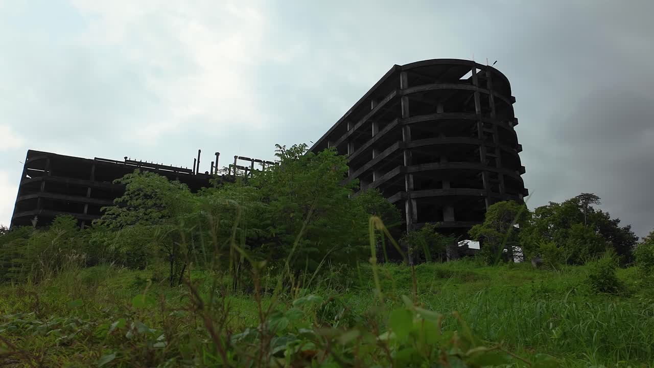 Abandoned famous building in Ranong Thailand. Known as the ghost building there that is totally abandoned and deserted. It is a concrete structure looking over Ranong Thailand