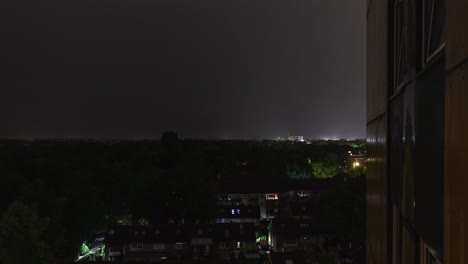 Time-lapse-sequence-of-thunderstorm-lightning-at-night-over-a-village