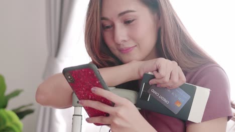 Woman-happy-selfie-portrait-with-her-passport-and-credit-card-before-travel-trip