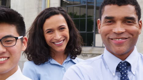 mixed race group of business people outdoors, panning shot