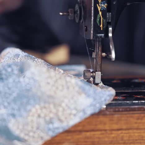 seamstress sews clothes on machine