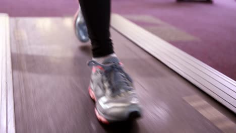 fit woman walking on the treadmill