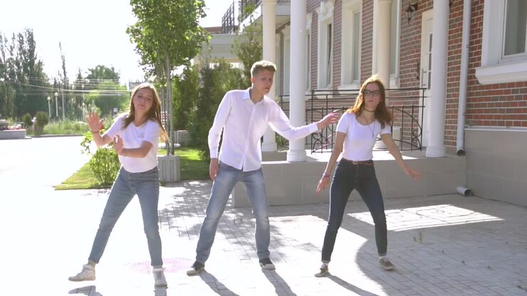 Teenagers Dancing and Walking Outdoors