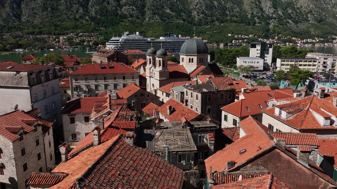 Cruise Ship At The Terminal With Saint Nicholas Church In Kotor, Montenegro. - aerial shot