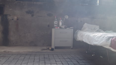 hard liquor, pills and ashtray on a nightstand, handheld, wide