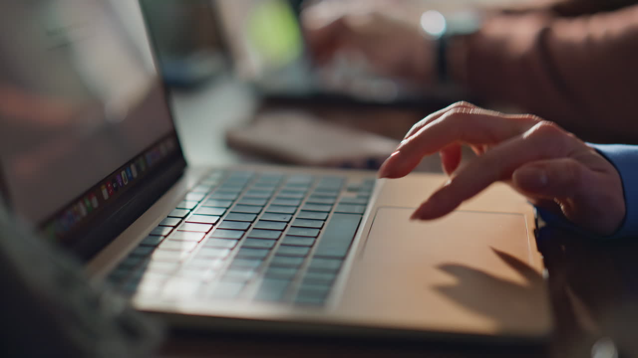 Freelancers hands typing keyboards in coworking space closeup. Unknown coworkers