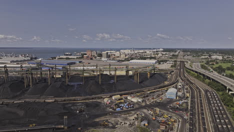 newport news virginia aerial v4 flyover dunbar coal transfer facility featuring black coal mounds and conveyor infrastructure support global energy export - shot with mavic 3 pro cine - sept 30th 2023