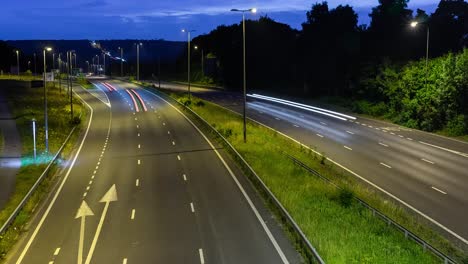 busy time lapse traffic at night on a dual carriageway united kingdom