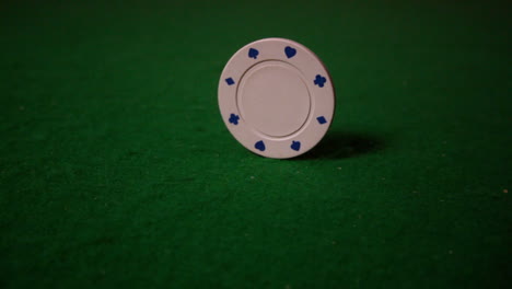 White-chip-spinning-on-casino-table