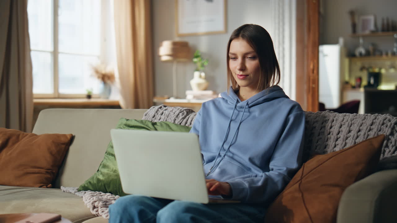Woman working on a laptop at home