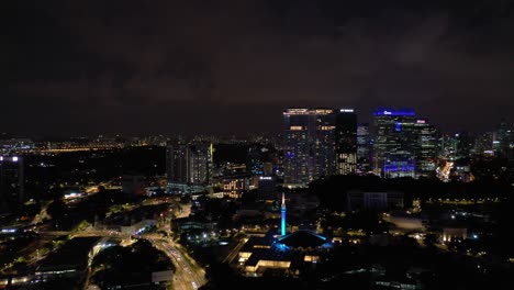 night time illuminated kuala lumpur city famous mosque traffic street aerial panorama 4k malaysia