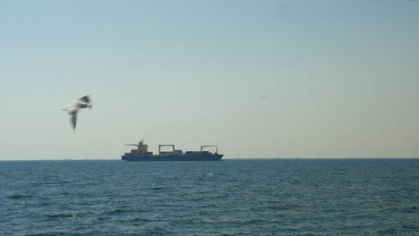 a cargo ship drifting in the sea