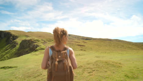 woman hiking in scenic mountains