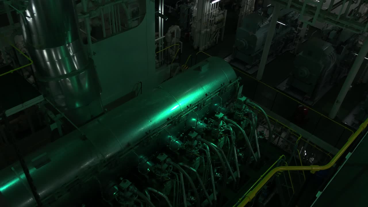 A real and top view of a huge ships main engine