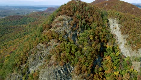 rocky mountain peak in new england forest wilderness landscape - aerial establishing drone view