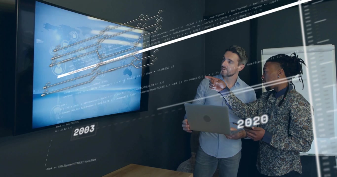 Two analysts tapping laptop and pointing digital map, adjusting timeline for tech trend analysis