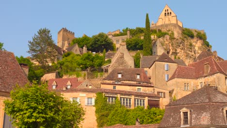 a captivating video showcasing the beautiful and historic medieval village of beynac, officially one of france's most beautiful villages, built into a hillside overlooking the dordogne river