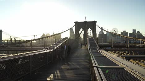 walking the brooklyn bridge at sunset