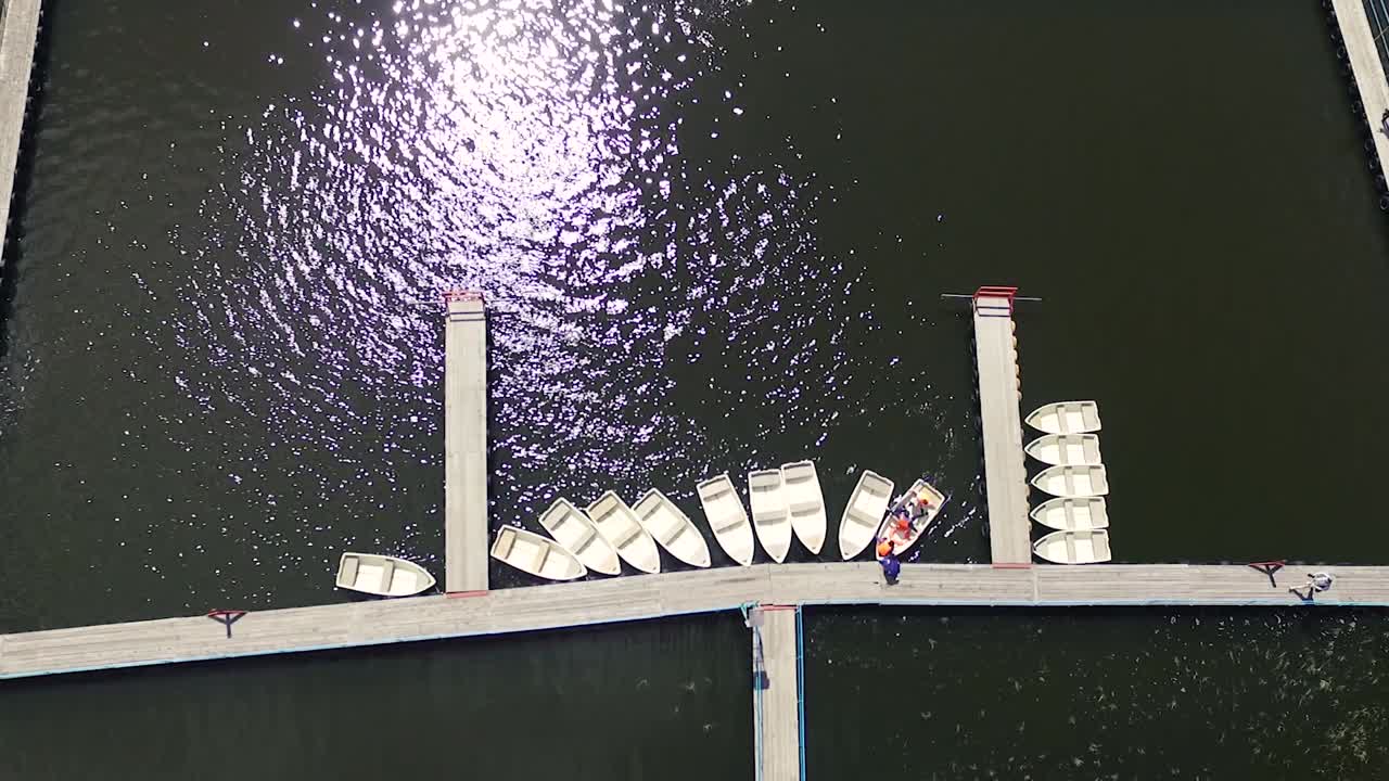 Aerial View of Boats Docked at Lakeside Pier