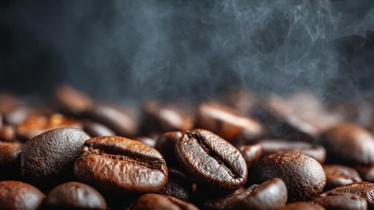 Aromatic Coffee Beans Surrounded by Smoke, Capturing the Essence of Freshly Roasted Arabica Coffee for the True Coffee Enthusiast and Connoisseur