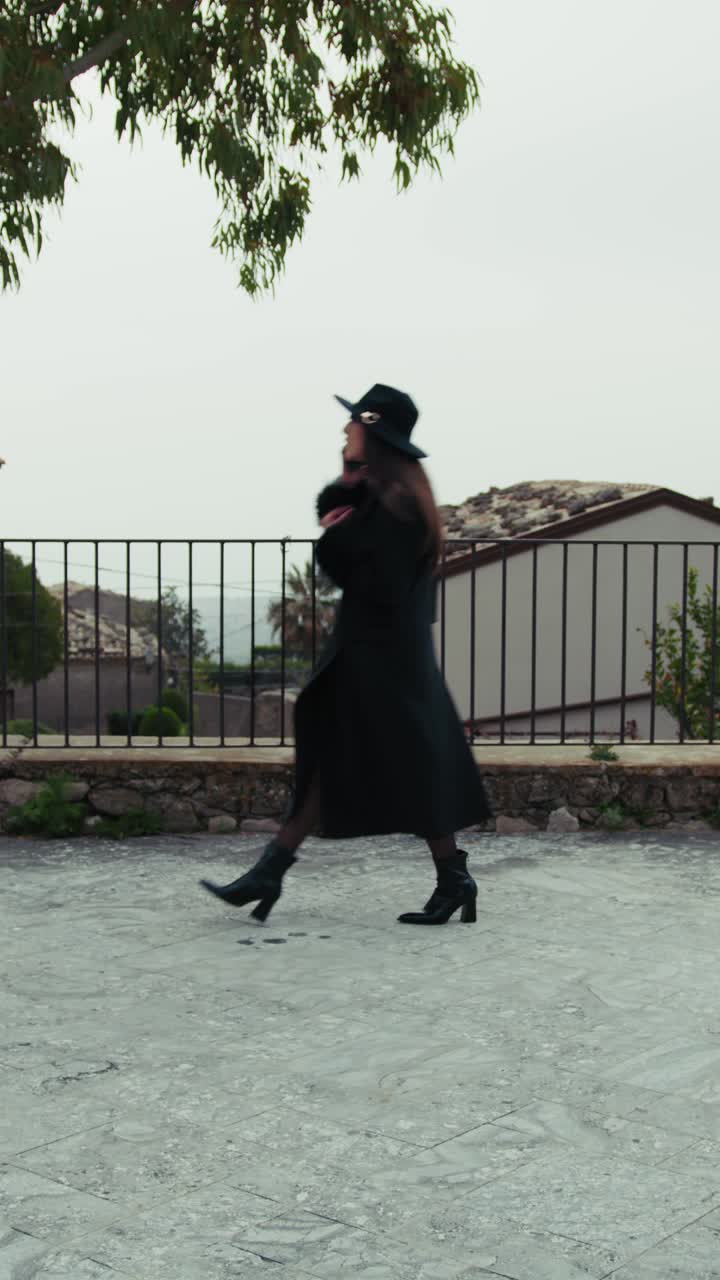Elegant Woman Walking In The Streets Of A Small Town In Italy
