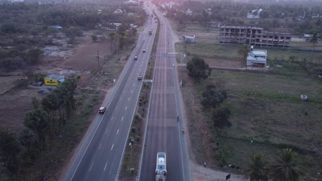 static aerial view of mumbai pune bangalore highway at sunset near davangere in karnataka, india