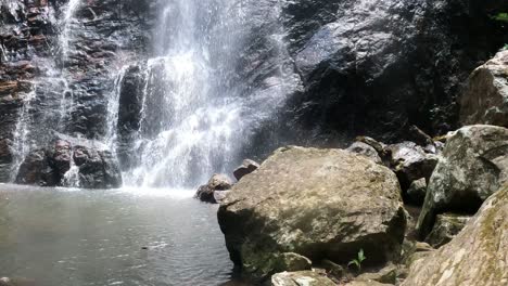 waterfall cascading over rocks into a tranquil pool