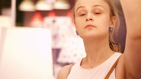 Young-woman-in-a-lamp-store