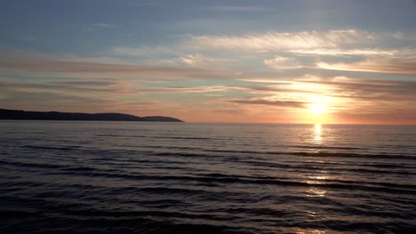 calming sunset over wavey ocean