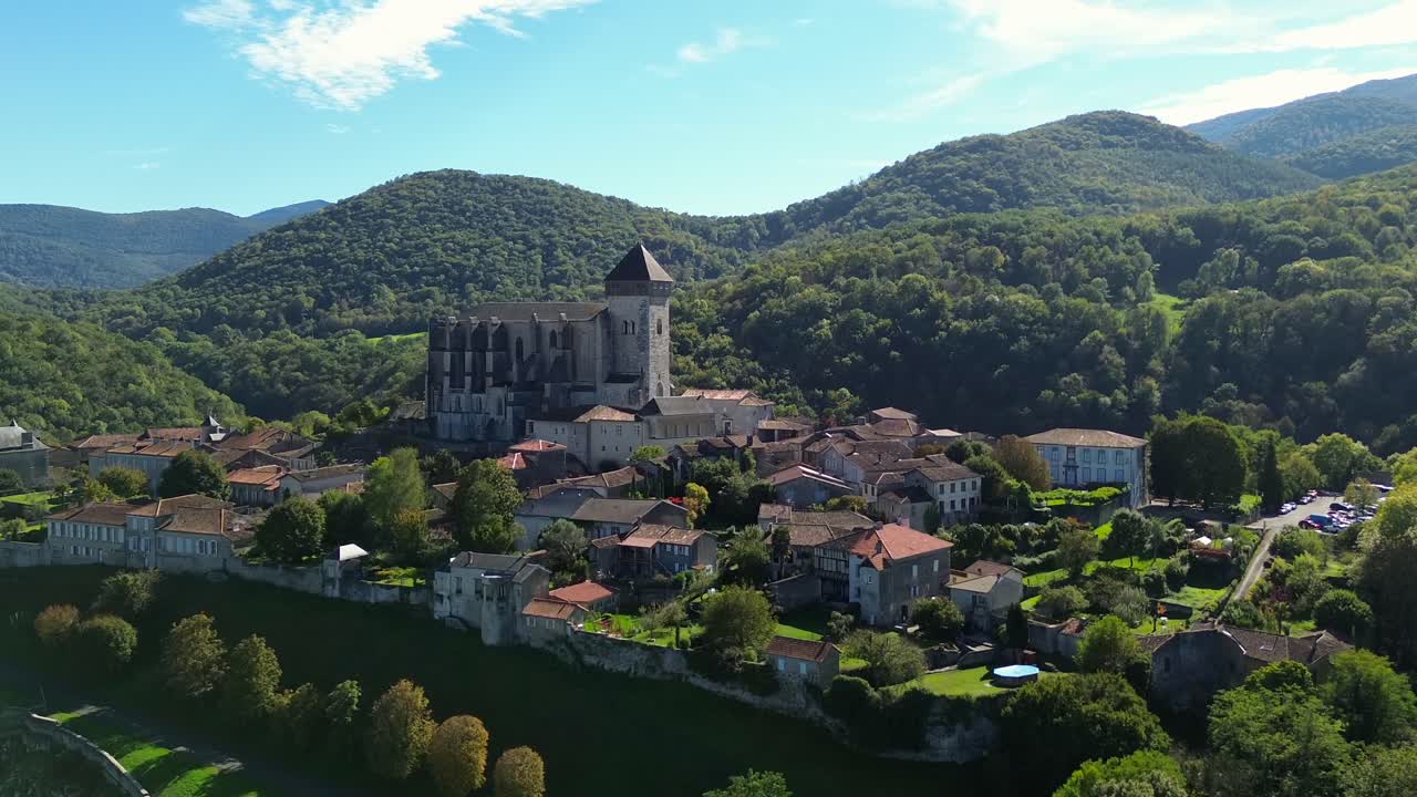 Saint-Bertrand-de-Comminges, a village of Southwestern France member of "The Most Beautiful Villages of France" association. (aerial view, Dolly forward)