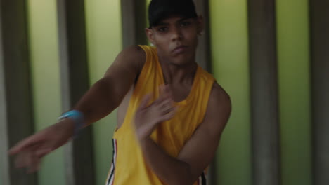 dancing-man-young-happy-street-dancer-performing-various-freestyle-dance-moves-fit-mixed-race-male-practicing-wearing-yellow-vest-close-up