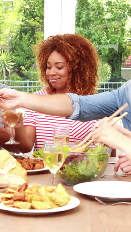 happy friends eating salad