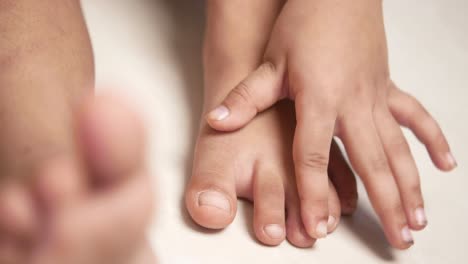 child's feet and hands