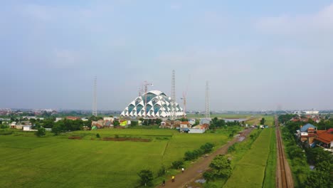 farmland with al jabbar great mosque background