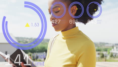 Animation of data processing over african american businesswoman in office