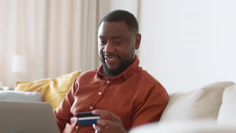 man shopping online at home