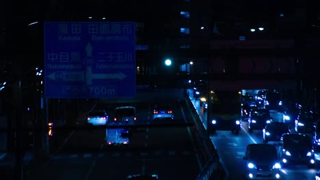 a night timelapse of the traffic jam at the city street in tokyo long shot