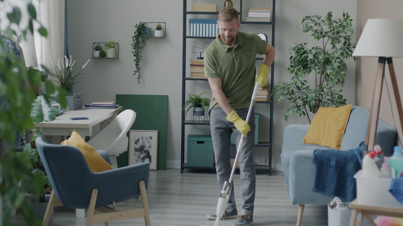Man Mopping the Living Room