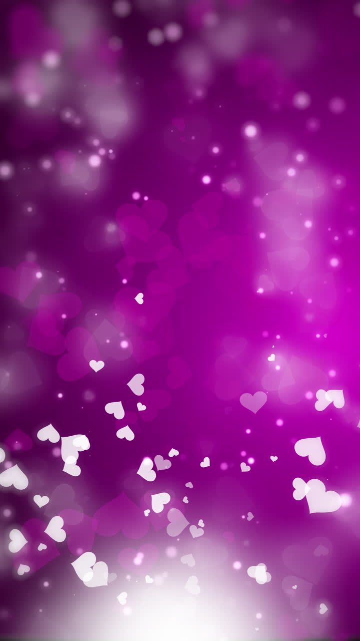 Confetti hearts flying on purple animated background. Valentine's Day. Glowing white particles. Looped motion graphics. Copy space. Vertical video.