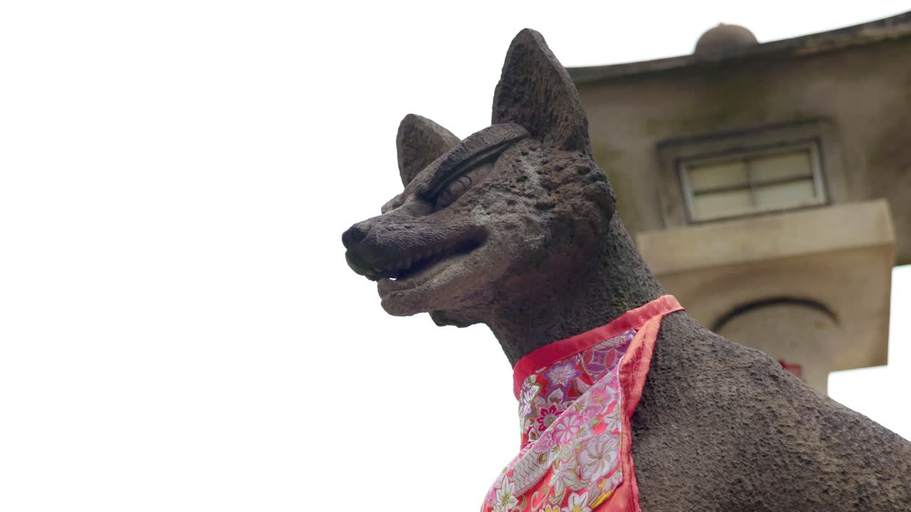 A Statue of a Fox in a Traditional Inari Shrine Japanese Temple in Tokyo, Japan