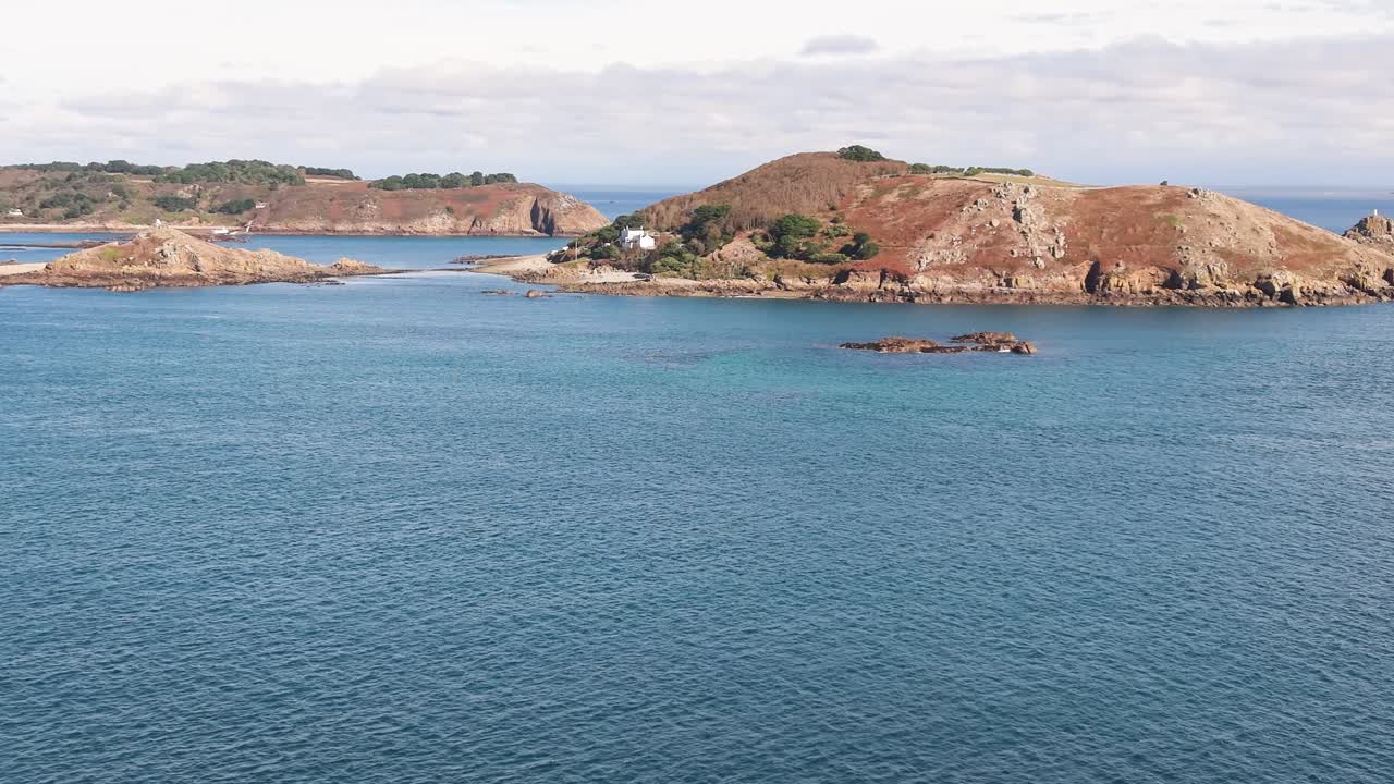 Jethou Channel Islands,flight towards this beautiful historic island on calm sunny day with Herm in the background