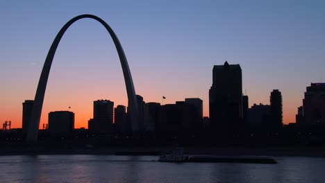 birds in migration fly past the st louis arch at dusk 1