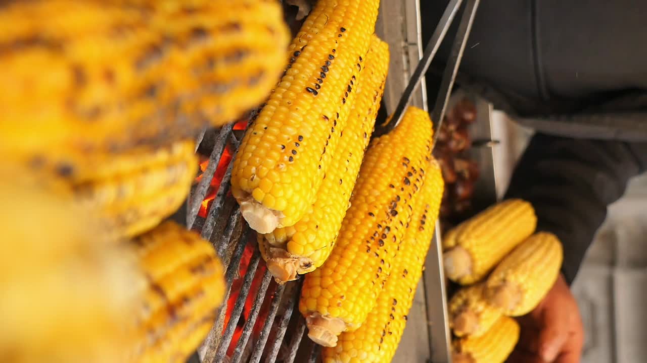 Close-Up of Fresh Corn Cobs Grilling on a Barbecue