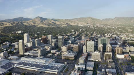 wide aerial view of salt lake city's downtown district with mountains in the backdrop