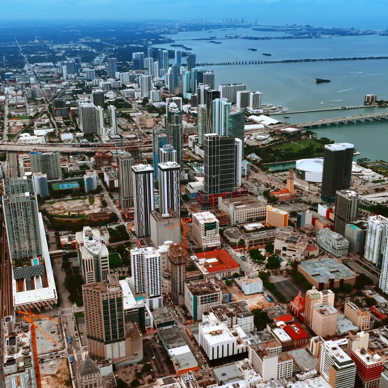 Vast scenery of Miami cityscape with multiple piers on the water. Wide array of architecture in the modern USA city.